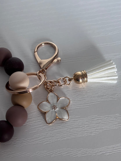 Hand‑Beaded Wristlet Keyring | Warm Neutrals & Floral Print with White Flower Charm