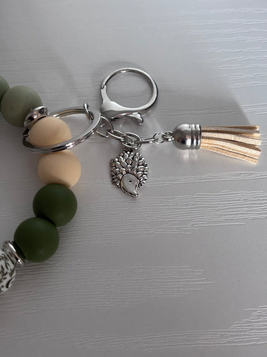 Hand‑Beaded Wristlet Keyring | Forest & Soft Greens, Cream & Hedgehog Charm